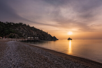 Picturesque Mediterranean seascape in Turkey. Colorful sunrise in a small bay near the Tekirova...