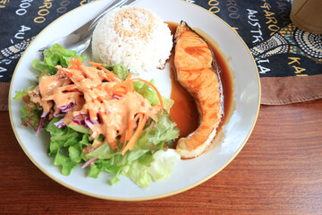Salmon fish fillet grilled and vegetable salad.
