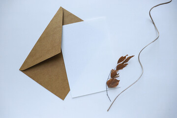 postcard mockup. autumn composition of dried flowers, leaves and twigs. invitation. congratulation. space for text 