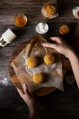 Mooncake a Chinese traditional pastry for Mid-Autumn festival. set on rustic wooden table.
