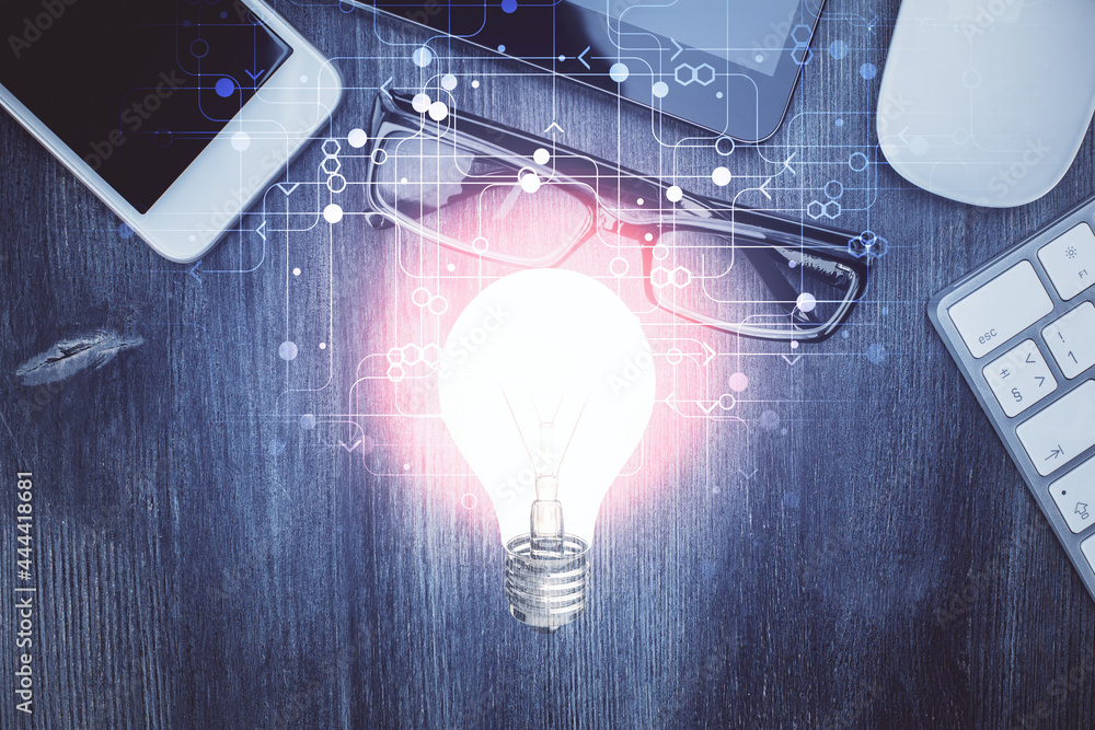 Poster double exposure of bulb drawing over table with phone. top view. concept of idea.