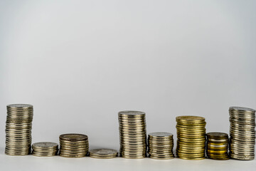 stacking of coins on top of the coin pile on the highest row. Placing coins in a row from low to high is comparable to saving money to grow more. Money saving ideas for investing in funds.