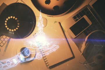 Double exposure of creative drawing and work table top veiw. Concept of startup.