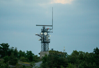 Large military of coast guard radar antenna and communications tower.