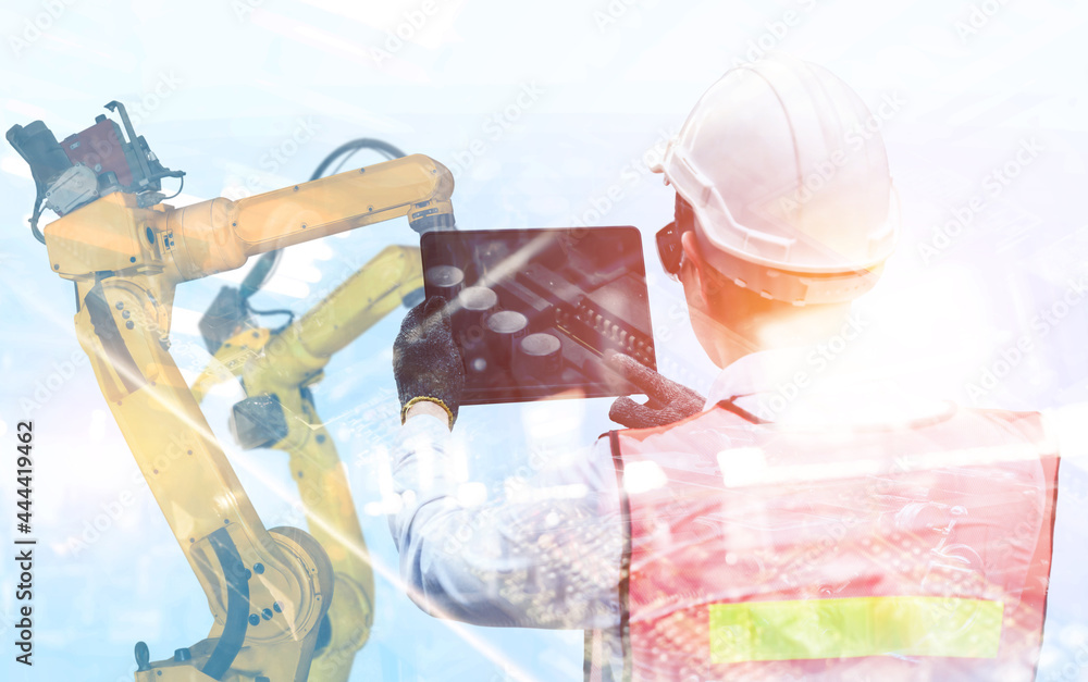 Poster mechanized industry robot arm and factory worker double exposure . concept of robotics technology fo
