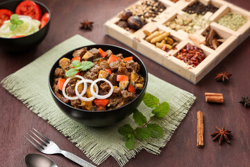 Spicy beef kaya curry beef fry South Indian Kerala India Sri Lanka. side dish Ghee rice, Appam, Parotta, Puttu. traditional Christian Muslim feast dish. Buffalo roast, meat pepper fry raw curry banana