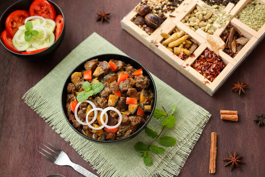 Spicy beef kaya curry beef fry South Indian Kerala India Sri Lanka. side dish Ghee rice, Appam, Parotta, Puttu. traditional Christian Muslim feast dish. Buffalo roast, meat pepper fry raw curry banana