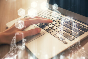Double exposure of woman hands typing on computer and technology theme drawing. High Tech concept.