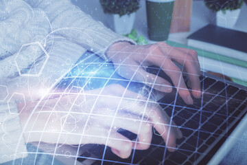 Double exposure of woman hands working on computer and world map hologram drawing. International technology business concept.