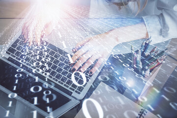 Double exposure of woman hands working on computer and data theme hologram drawing. Tech concept.