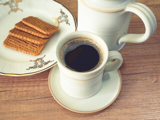 Cup of coffee and cookies on the table