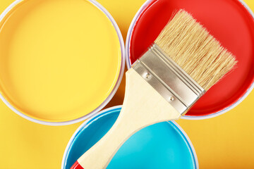 Paint cans color palette with paint brush on yellow background,home renovation concept