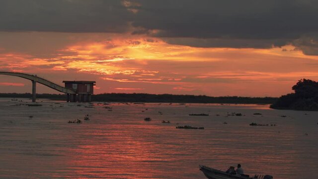 Beautiful orange and purple sunset landscape over the Paraguay River near the city of Corumba, Brazil