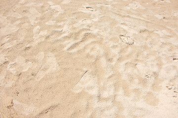 The sandy beach is beautiful but full of tourist footprints.