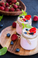 Healthy smoothie of fresh summer berries. Creative atmospheric decoration