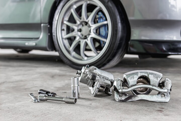 Calliper Standard brake part remove on the floor in garage tool for basic service and maintenance 