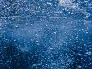 Blue sea bubbles rising to the surface of the sea, azure sea water, 	
Underwater bubbles, under the Mediterranean sea, very suitable landscape picture for backgrounds, blue background of underwater.