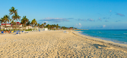 Cayo Coco, Cuba, 16 may 2021: Sandy beach of the hotel Tryp Cayo Coco with sun loungers and tall...