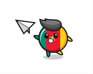 Obraz premium cameroon flag badge cartoon character throwing paper airplane