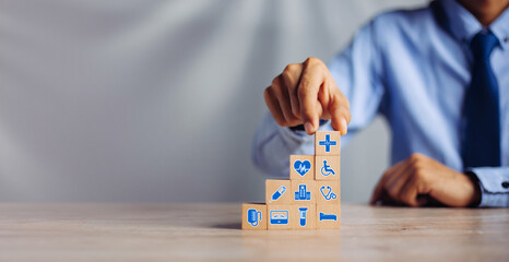 Hand arranging wood block stacking with icon healthcare medical, Insurance for your health medical,...