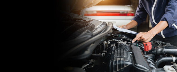 Automobile mechanic repairman hands repairing a car engine automotive workshop with a wrench, car...