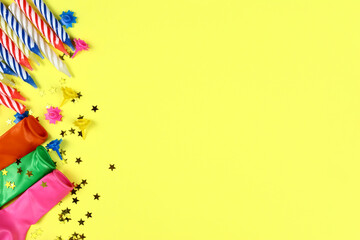 Festive background with birthday decor. Candles, balloons and confetti