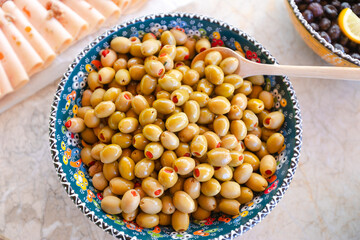 Amazing bowl of olives on the table.