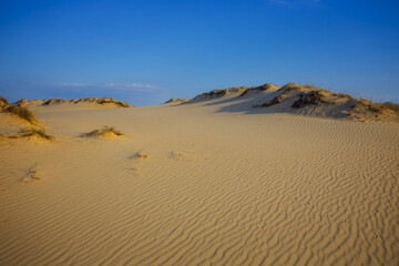 sandy desert dune under a cloudy sky, hot summer natural scene