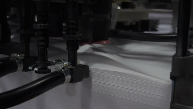 Printing offset machine paper feed. Printing house.