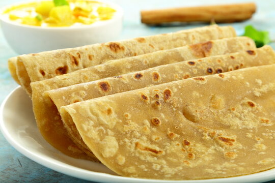 Chapati Isolated Over A Rustic Wooden Background Selective Focus Stock  Photo - Download Image Now - iStock