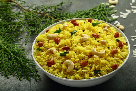 Healthy eating, Poha, traditional Indian cooking recipes, rice flakes dry cooked with spices.
