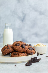 Double Chocolate oats Cookies - Styled with a bottle of milk and oats and chocolate 