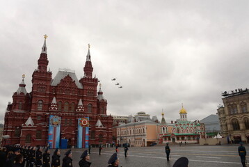A group of Mi-35M and Mi-24 attack combat helicopters in the sky over Moscow's Red Square during the Victory Air Parade