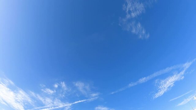 pastel soft blue sky white transparent cloud in a clear atmosphere, fresh air, and good weather. abstract clouds sky nature, b-roll footage nature background. wide angle view of bright sunny blue sky.