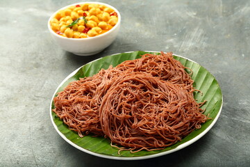 Top view- healthy organic red rice flour steamed rice noodles, served with chickpea curry....