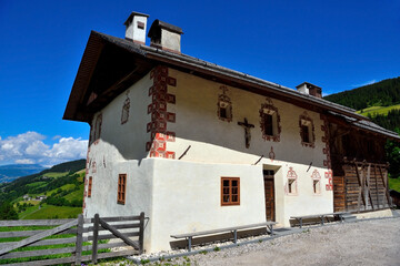Fototapeta na wymiar characteristic historic house in st maddalena in val di funes south tyrol italy