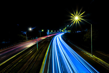 Fototapeta na wymiar Light trails on a motorway at night, Perth, Western Australia, Australia 
