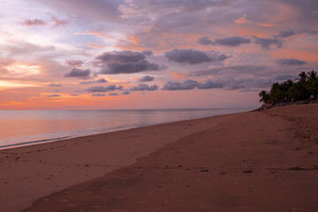 beautiful soft orangeand pink sun light sunset in sea behind island. soft golden sand beach calm and romantic place in thailand