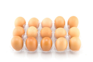 Eggs in plastic box isolated on white background