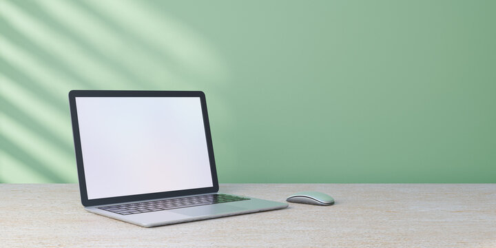 3D rendering object. Laptop computer mouse placed on wood desk and pastel green wall with sun light.