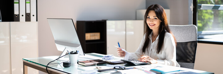 Accountant At Desk Using Finance Technology