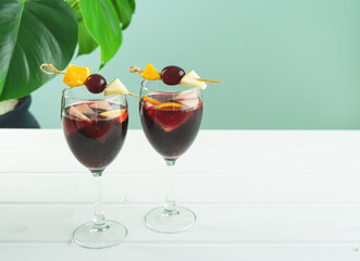 Sangria glasses on white wooden background. Traditional Spanish drink. Copy space.