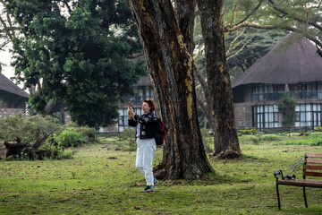 Fototapeta premium woman tourist in national park on safari 