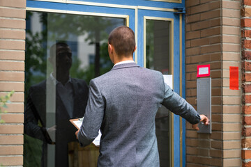 Bailiff Debt Collector Touching Doorbell. Confiscation - Powered by Adobe