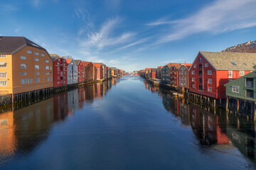 Colourful houses with reflection by the river in Trondheim, Norway