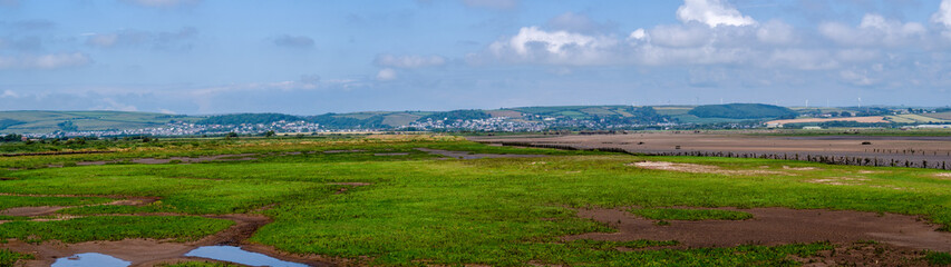 Fototapeta na wymiar Panoramic landscape view of low tide at Horsey Island, Braunton Marsh, Devon, UK.