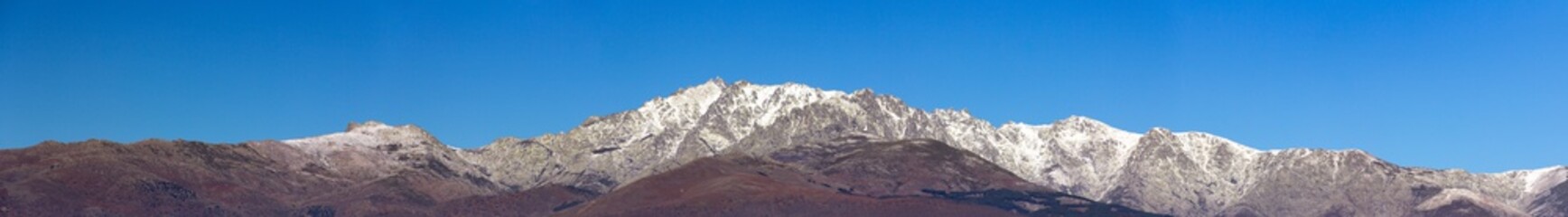Panoramic view of the profile of the Gredos mountain in Spain with snow on the peaks.
