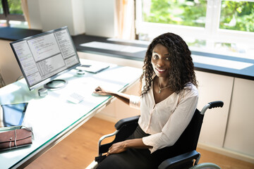 African American Black Woman Using Computer. Handicapped Worker