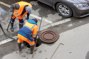 Two men repairing of water supply system