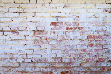 brick wall with traces of white paint